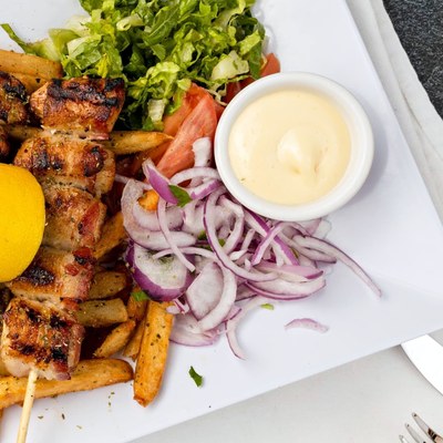 Pork souvlaki skewers with fries