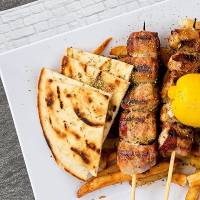 Pork souvlaki with pita and fries