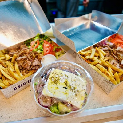Gyro and fries with Greek salad